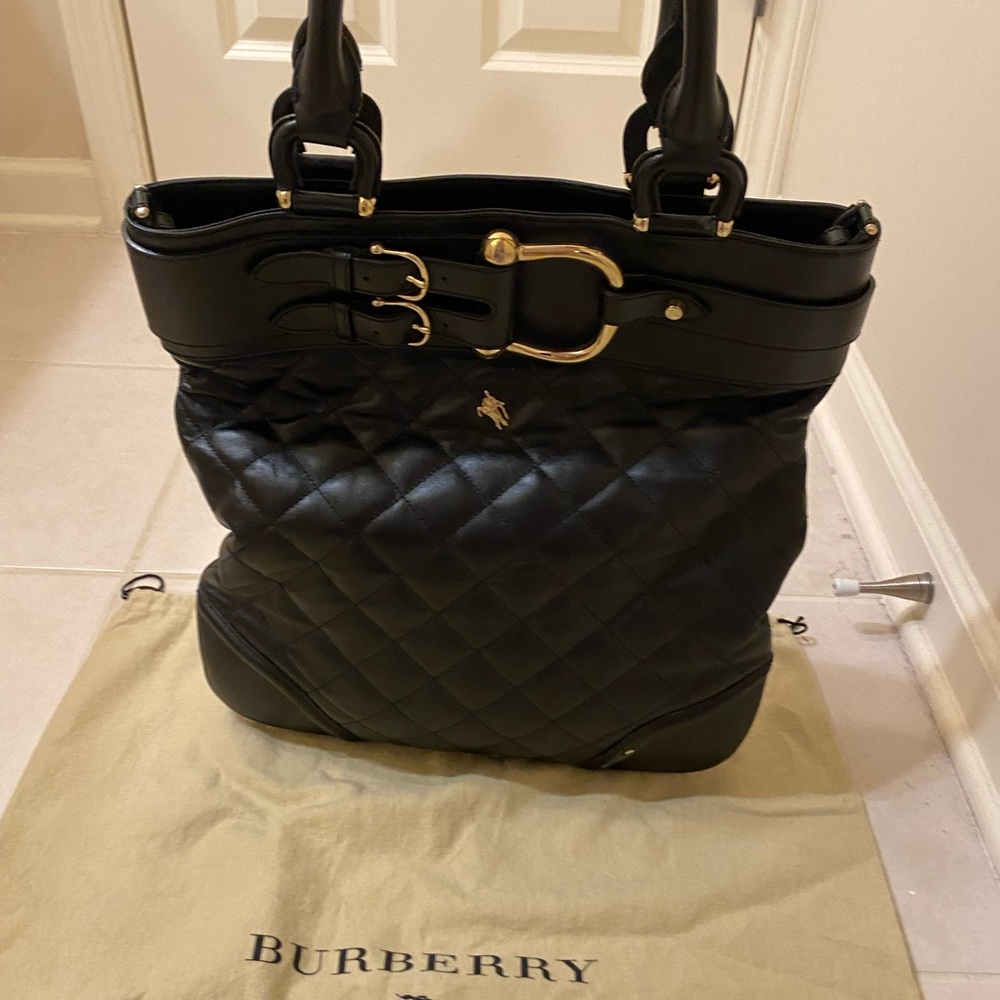 Authentic Burberry black leather horse shoe hardware
